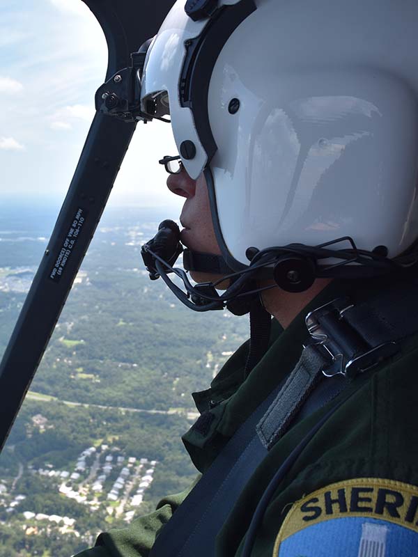 Officer flying helicopter